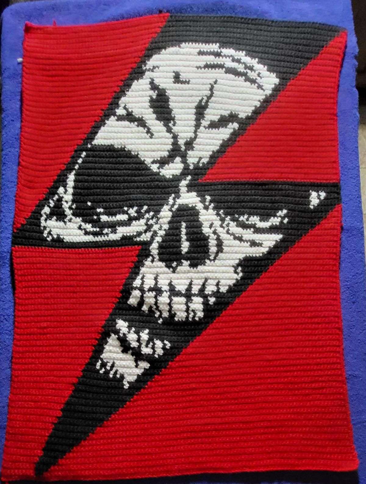 Finished Devil Single Crochet graphghan blanket in red black and white yarn